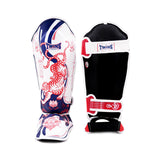 Angled view of Twins Special FSGL10-67 YANT leather shin guards showing contoured shin padding, reinforced instep protection and secure hook-and-loop straps on a white background