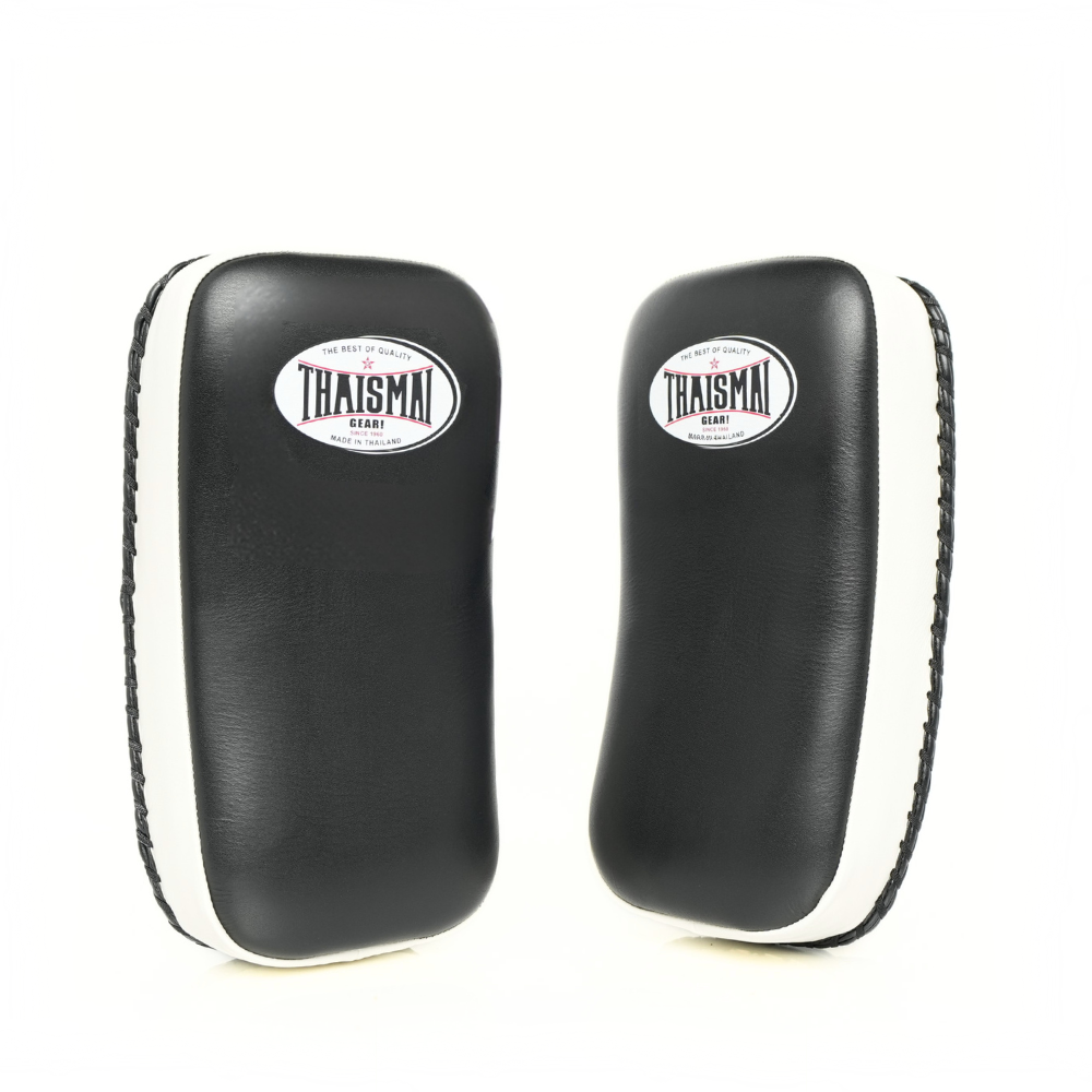 Front view of a pair of THAISMAI KP142 Muay Thai kick pads in black and white, featuring the smooth target faces and THAISMAI logo.
