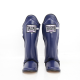 Front view of the navy blue THAISMAI LP184 Muay Thai shin guards, showing the padded shin panels, brand labels and foot sections against white.