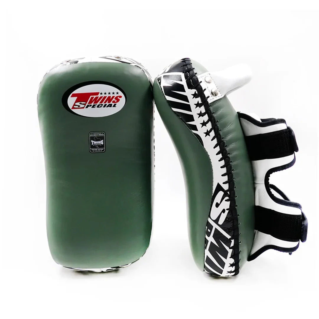 Twins Special KPL-12 Deluxe kicking pads in black and gray with dense impact padding, curved striking surface and secure dual-strap hand compartments for Muay Thai and kickboxing training on a white background