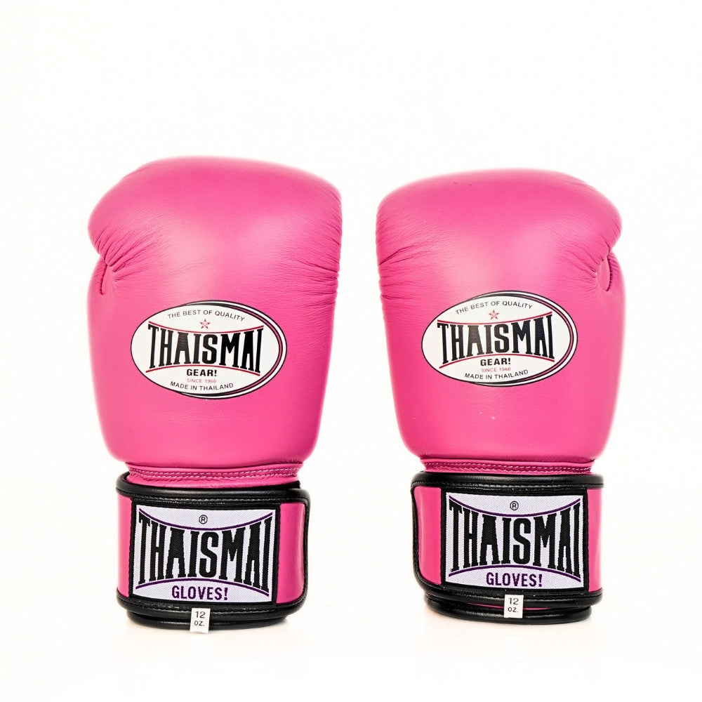 Pair of pink THAISMAI BG124 boxing gloves shown side by side from the front, with white oval branding, black wrist cuffs and a white background.