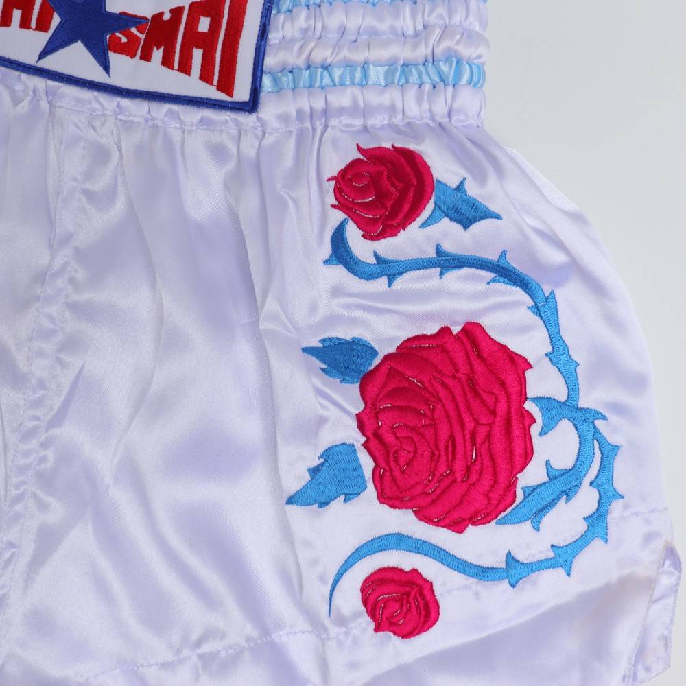 THAISMAI BS-ROSE Rose Embroidery Muay Thai shorts in lightweight satin with floral rose embroidery, elastic waistband and traditional side-slit cut on a white background