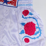 THAISMAI BS-ROSE Rose Embroidery Muay Thai shorts in lightweight satin with floral rose embroidery, elastic waistband and traditional side-slit cut on a white background