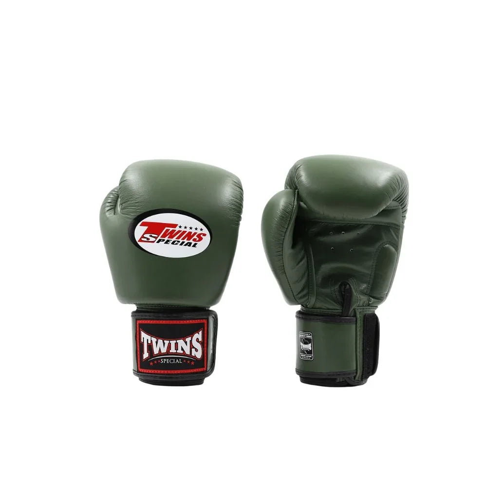 Pair of olive green Twins Special boxing gloves showing the front logo, rear padding, black wrist straps and brand patches on a white background