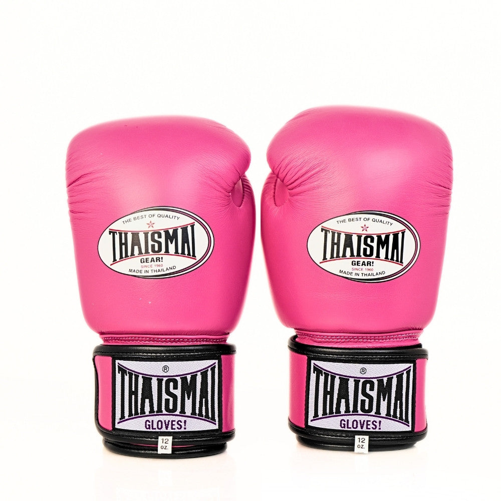 Two pink THAISMAI BG124 boxing gloves shown side by side from the front, with white oval glove logos, black wrist trim and a white background.