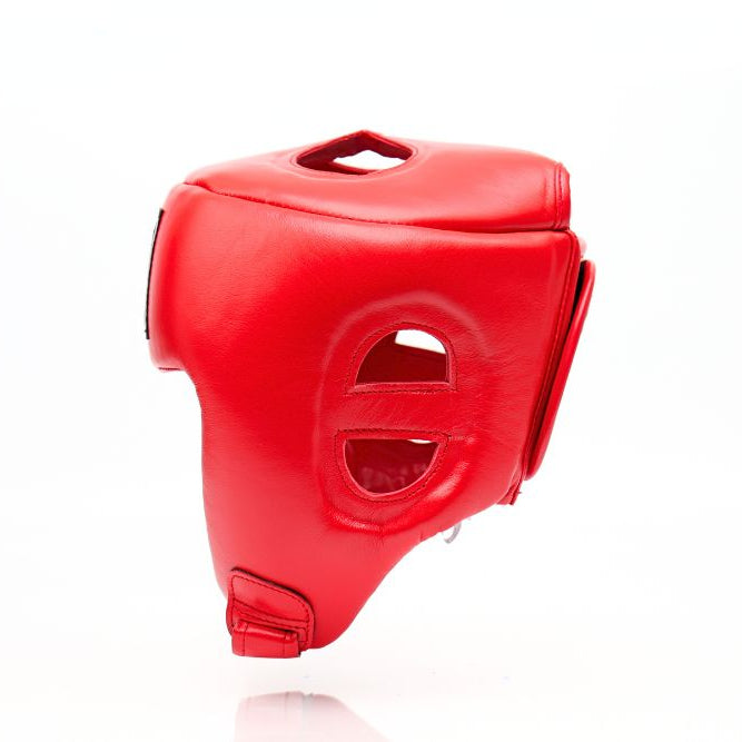 Side view of the red THAISMAI HG-152 Muay Thai sparring head guard with padded shell and ear openings