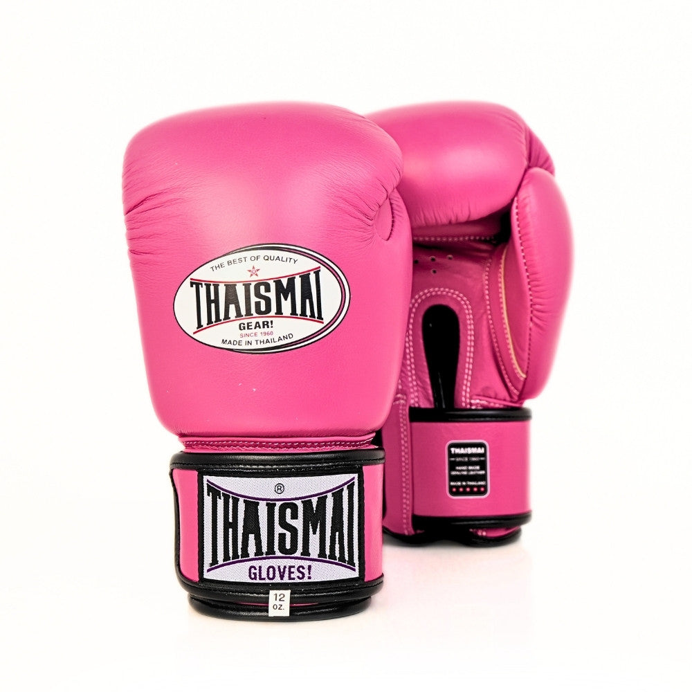 Pair of pink THAISMAI BG124 boxing gloves shown from the front and back, with black wrist straps, white THAISMAI branding and a white background.