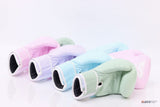 Four padded boxing gloves in pastel pink, lavender, light blue and mint green arranged in a row on a reflective white background