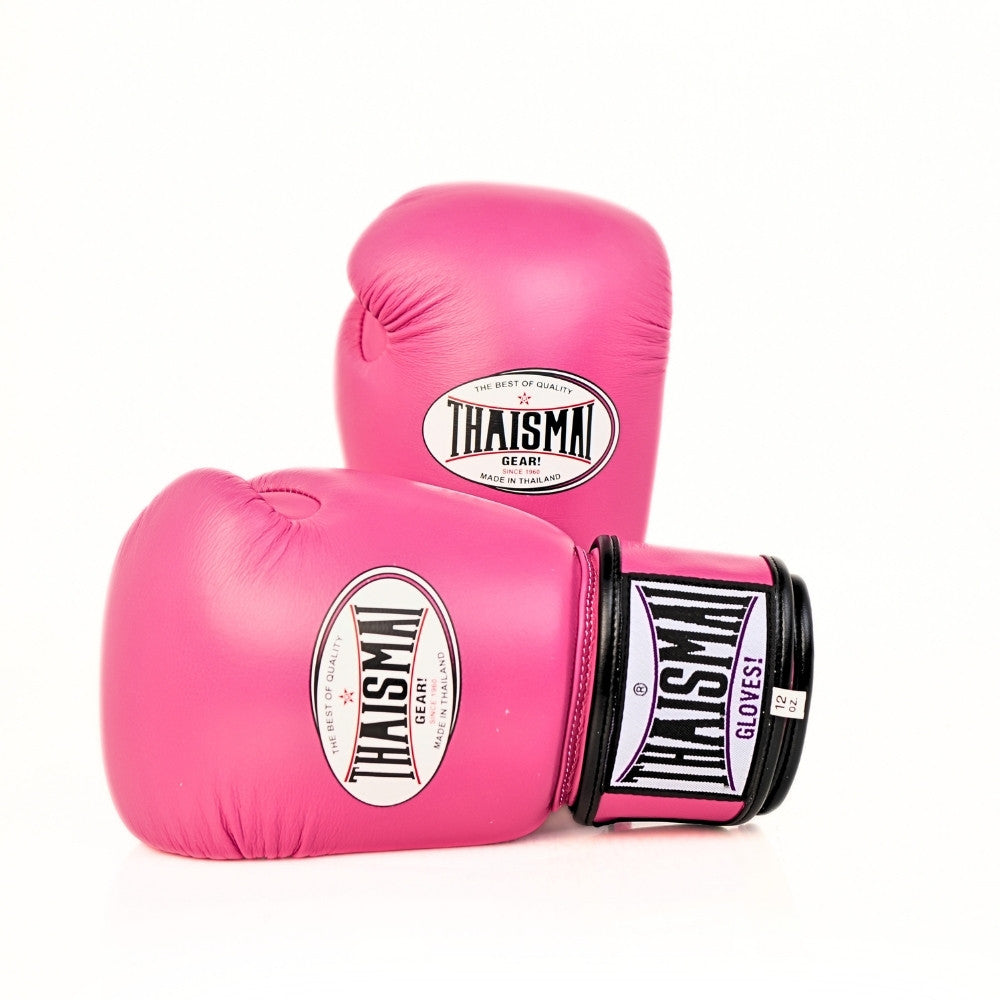 Two pink THAISMAI BG124 boxing gloves arranged at an angle on a white background, showing the glove logos, black wrist trim and wraparound strap.