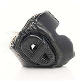 Side profile of the black THAISMAI HG-152 Muay Thai sparring head guard showing padded ear and cheek guards on a white background