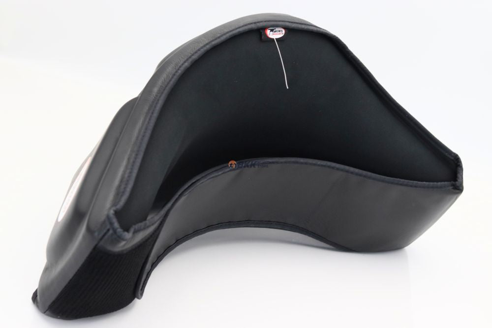 Twins Special black protective headguard with padded coverage and Twins branding on a white background