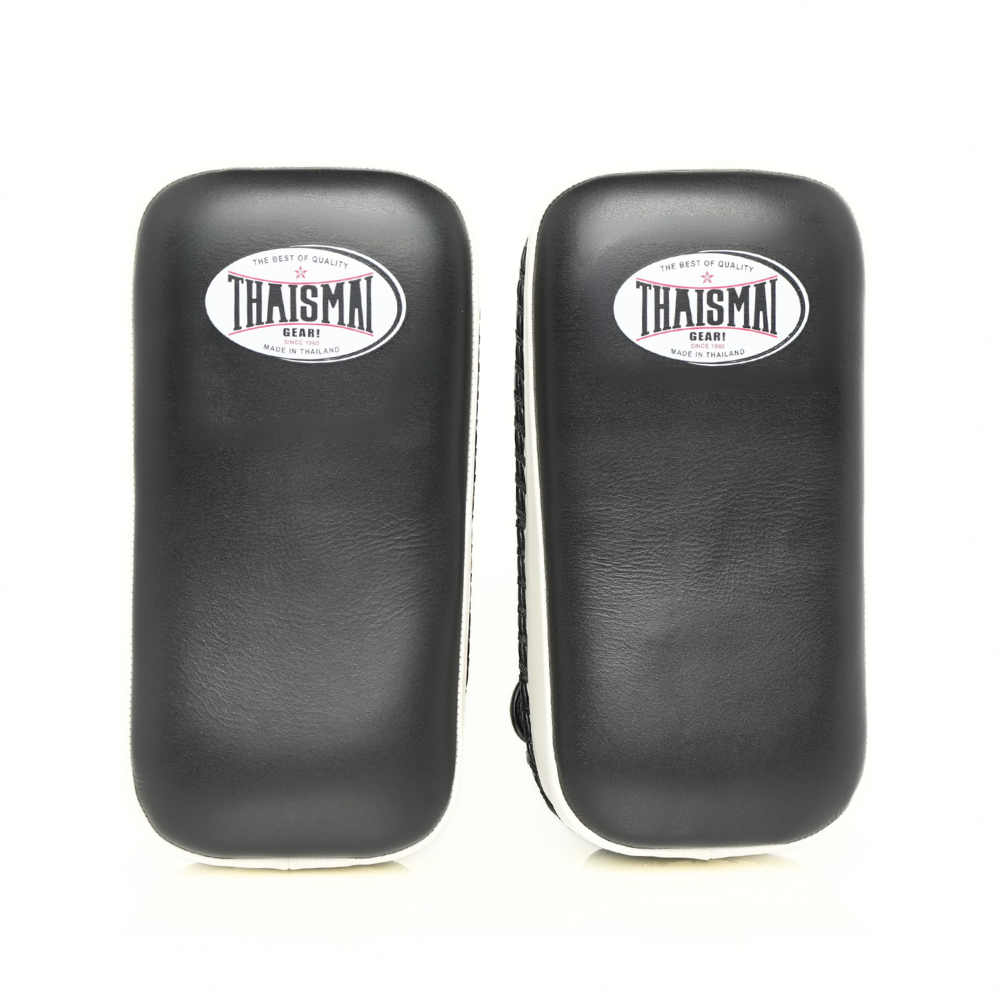 Front view of the THAISMAI KP142 Muay Thai kick pads in black with white trim and THAISMAI logos.