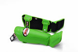 Angled view of green Twins Special SGL-10 shin guards showing contoured shin and instep padding, wide hook-and-loop closures, and padded foot support for Muay Thai and kickboxing on a white background