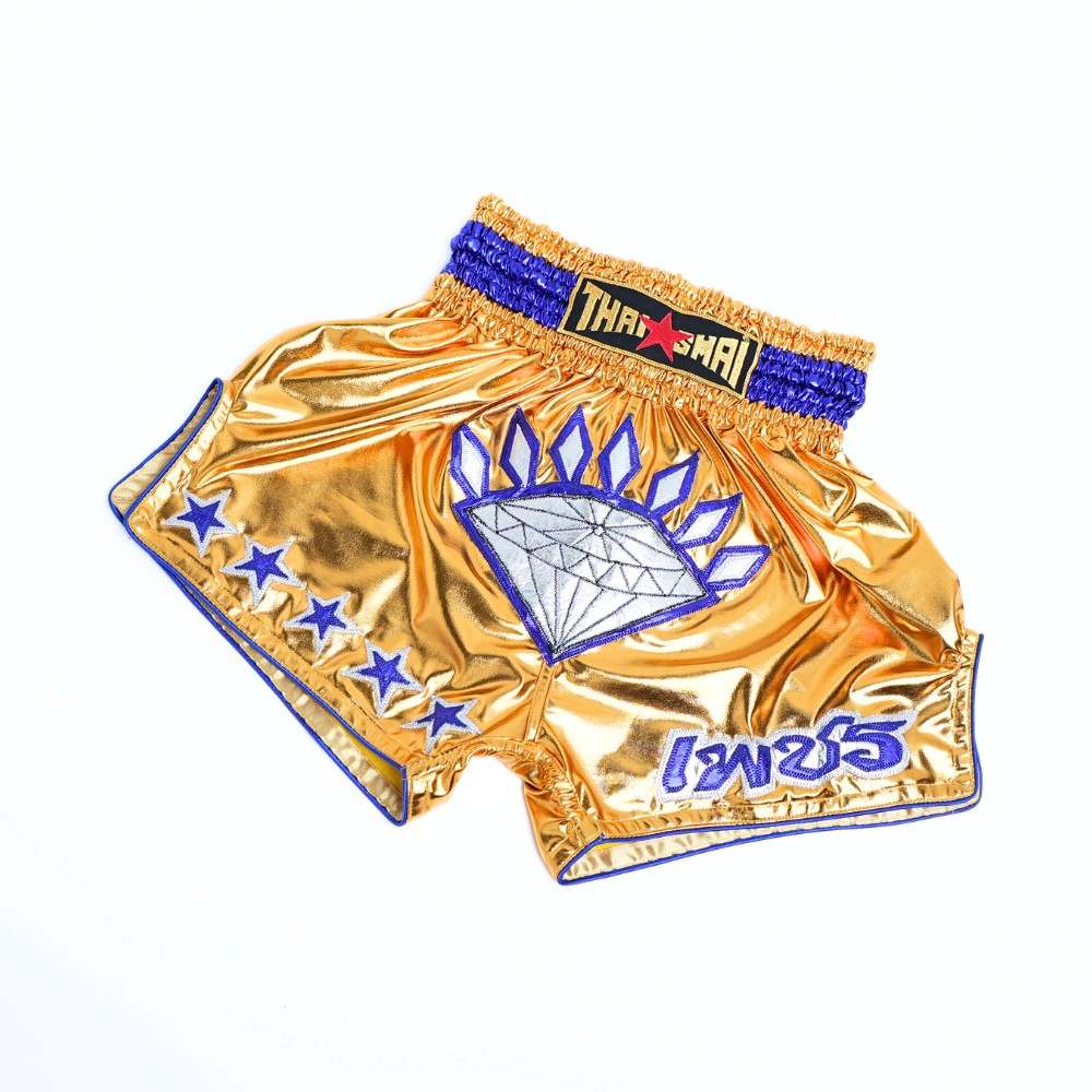 Angled view of ThaiSmai Golden Era Diamond Muay Thai shorts showing the satin fabric, diamond motif, contoured side panels and elastic waistband on a white background
