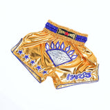 Angled view of ThaiSmai Golden Era Diamond Muay Thai shorts showing the satin fabric, diamond motif, contoured side panels and elastic waistband on a white background