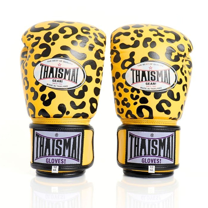 ThaiSmai FBG124 Leopard Muay Thai boxing gloves in genuine leather with yellow-and-black leopard print, padded knuckles and secure wrist support, pair on a white background