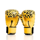 ThaiSmai FBG124 Leopard Muay Thai boxing gloves in genuine leather with yellow-and-black leopard print, padded knuckles and secure wrist support, pair on a white background