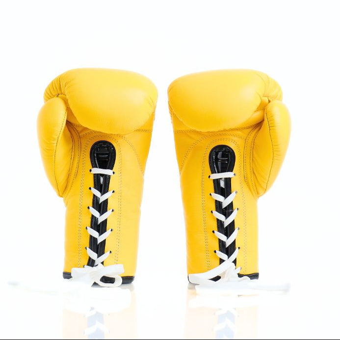 ThaiSmai BG121 lace-up boxing gloves in bright yellow leather with classic lace closure, reinforced multi-layer padding and secure wrist support for boxing and Muay Thai training on a white background