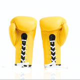 ThaiSmai BG121 lace-up boxing gloves in bright yellow leather with classic lace closure, reinforced multi-layer padding and secure wrist support for boxing and Muay Thai training on a white background