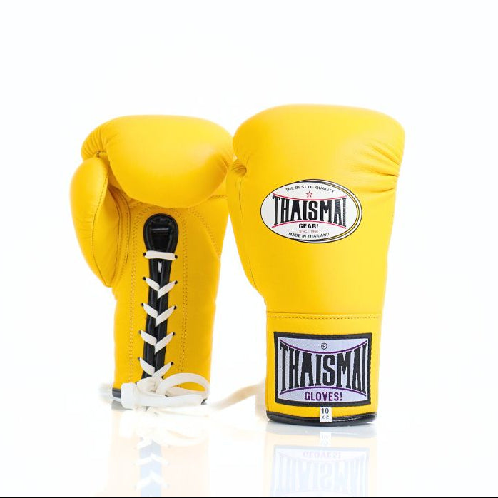 Yellow boxing gloves with 'Thaismai' branding on a white backgroundThaiSmai BG121 lace-up boxing gloves in bright yellow leather with classic lace closure, reinforced multi-layer padding and secure wrist support for boxing and Muay Thai training on a white background