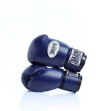 THAISMAI BG124 Muay Thai boxing gloves in dark blue leather with reinforced multi-layer padding, secure hook-and-loop wrist closure and white-purple logo details on a white background