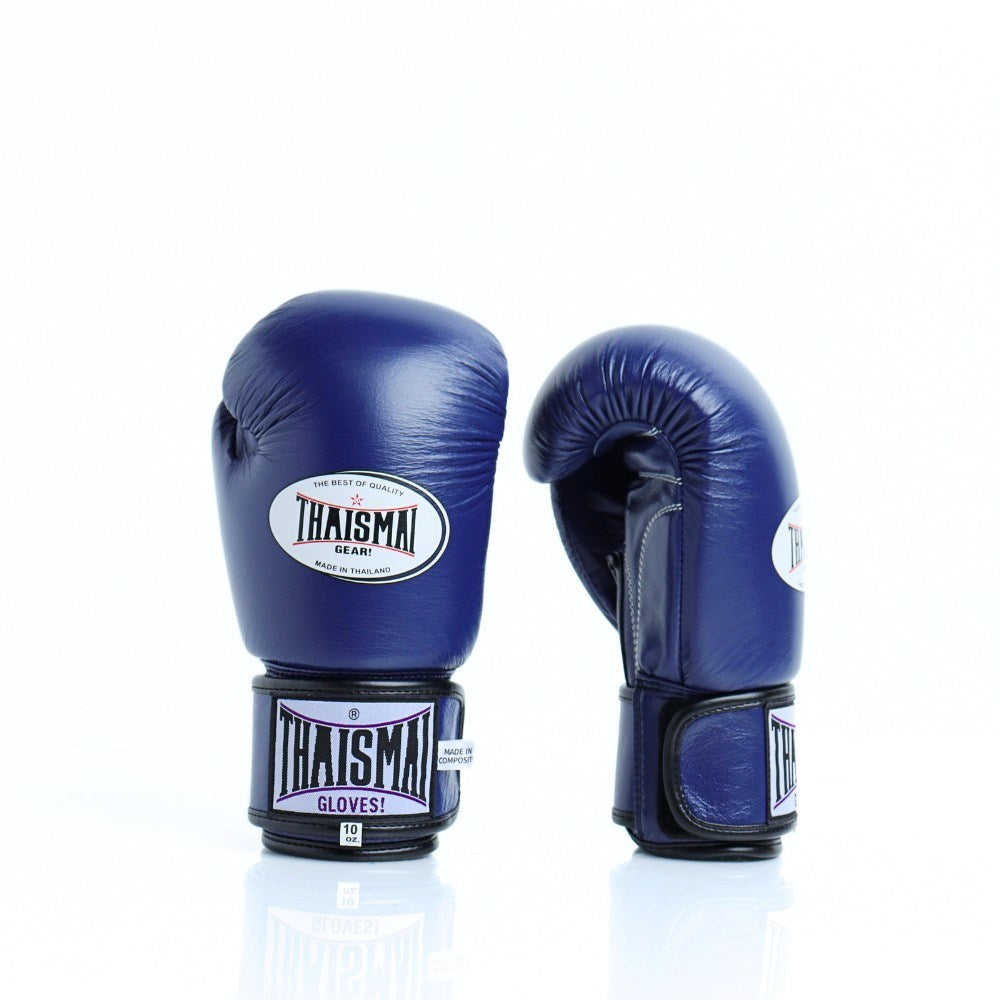 THAISMAI BG124 Muay Thai boxing gloves in dark blue leather with reinforced multi-layer padding, secure hook-and-loop wrist closure and white-purple logo details on a white background