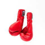 ThaiSmai BG121 lace-up boxing gloves in red leather with classic white lace closure, reinforced padding and secure wrist support for boxing and Muay Thai training on a white background