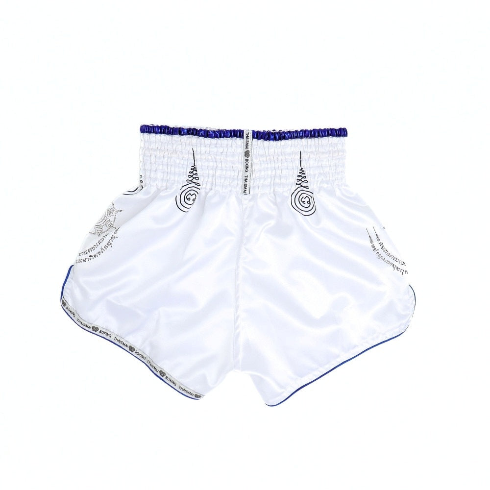 THAISMAI SAK YANT Muay Thai boxing shorts in lightweight satin with Thai lettering, classic side-slit cut and traditional fightwear design on a white background