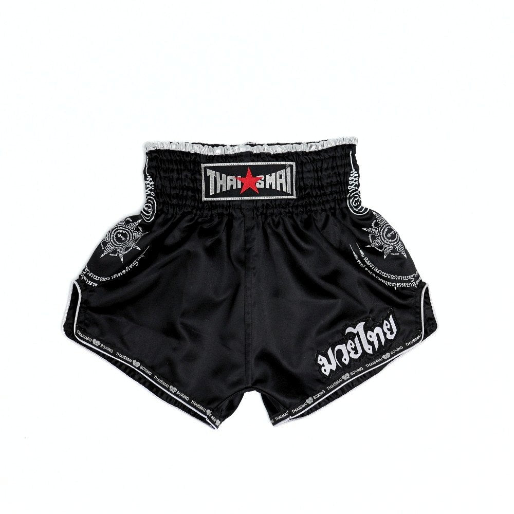 THAISMAI SAK YANT Muay Thai boxing shorts in lightweight satin with Thai lettering, classic side-slit cut and traditional fightwear design on a white background