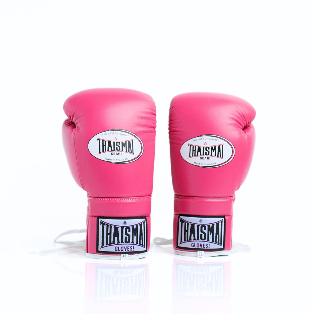 ThaiSmai BG121 lace-up boxing gloves in pink leather with white lace closure, reinforced padding and secure wrist support for boxing and Muay Thai training on a white background