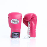 ThaiSmai BG121 lace-up boxing gloves in pink leather with white lace closure, reinforced padding and secure wrist support for boxing and Muay Thai training on a white background