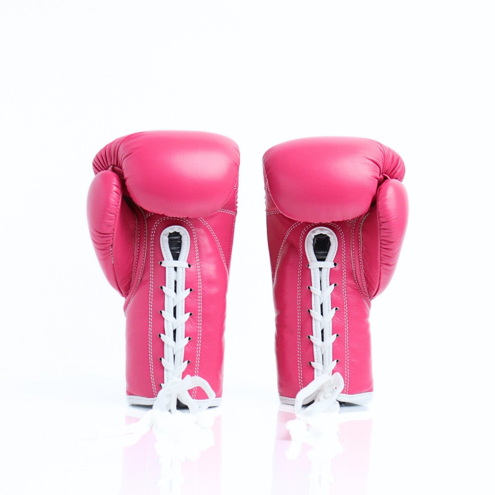 ThaiSmai BG121 lace-up boxing gloves in pink leather with white lace closure, reinforced padding and secure wrist support for boxing and Muay Thai training on a white background