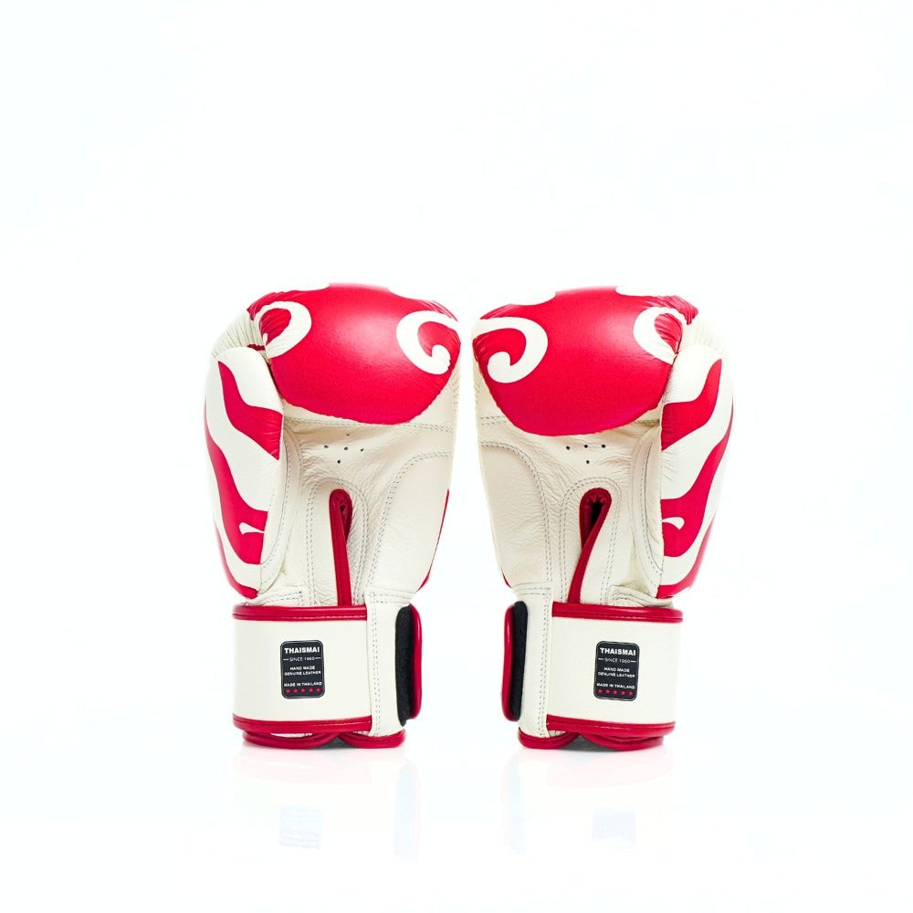 THAISMAI FBG124 Flame Muay Thai boxing gloves in white leather with red flame artwork, reinforced multi-layer padding and secure hook-and-loop wrist closure on a white background