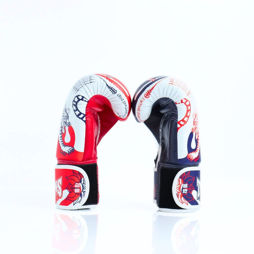 Side view of Twins Special FBGVL4-67 SAK YANT boxing gloves showing the padded glove profile, thumb protection and hook-and-loop wrist fastening on a white background