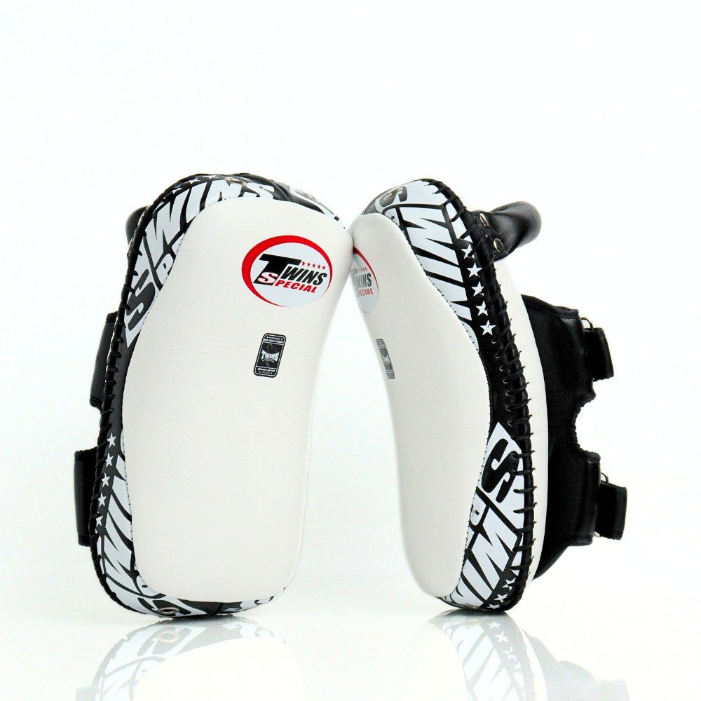 Twins Special KPL-12 Deluxe kicking pads in black and gray with dense impact padding, curved striking surface and secure dual-strap hand compartments for Muay Thai and kickboxing training on a white background