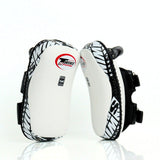 Twins Special KPL-12 Deluxe kicking pads in black and gray with dense impact padding, curved striking surface and secure dual-strap hand compartments for Muay Thai and kickboxing training on a white background