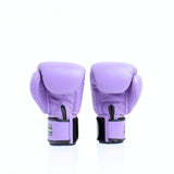 Rear view of a pair of lavender Twins Special boxing gloves showing black hook-and-loop wrist straps on a white background with a soft reflection