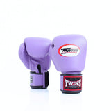 Pair of lavender Twins Special boxing gloves showing the front logo and rear glove with black hook-and-loop wrist strap and branded wrist patch on a white background