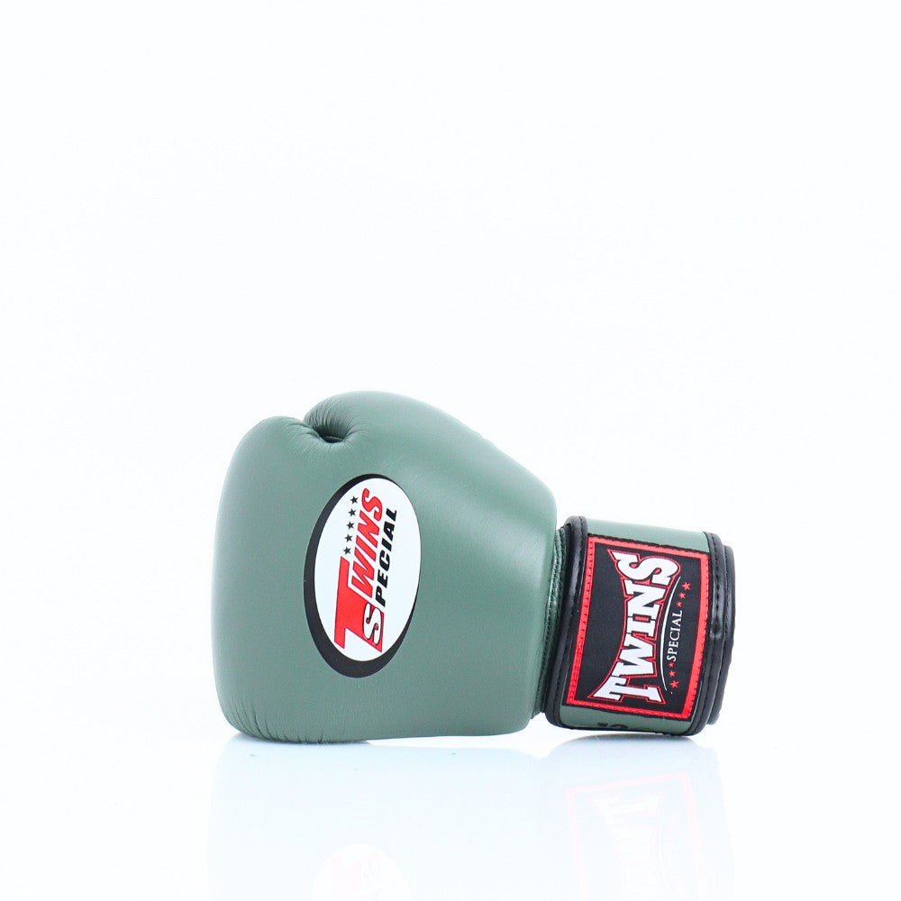 Single olive green Twins Special boxing glove showing the front Twins logo and branded wrist patch on a white background