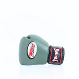Single olive green Twins Special boxing glove showing the front Twins logo and branded wrist patch on a white background