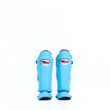 Twins Special SGL-10 shin guards in black synthetic leather with full-length shin and instep protection, secure hook-and-loop straps and padded support for Muay Thai and kickboxing training on a white background