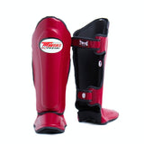 Twins Special SGL-10 shin guards in black synthetic leather with full-length shin and instep protection, secure hook-and-loop straps and padded support for Muay Thai and kickboxing training on a white background