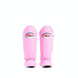 Twins Special SGL-10 shin guards in black synthetic leather with full-length shin and instep protection, secure hook-and-loop straps and padded support for Muay Thai and kickboxing training on a white background
