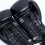 Twins Special BGLL-1 lace-up boxing gloves in premium Thai leather with secure lace closure, attached thumb and competition-style padding for boxing and Muay Thai training on a white background