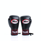 Twins Special BGLL-1 lace-up boxing gloves in premium Thai leather with secure lace closure, attached thumb and competition-style padding for boxing and Muay Thai training on a white background