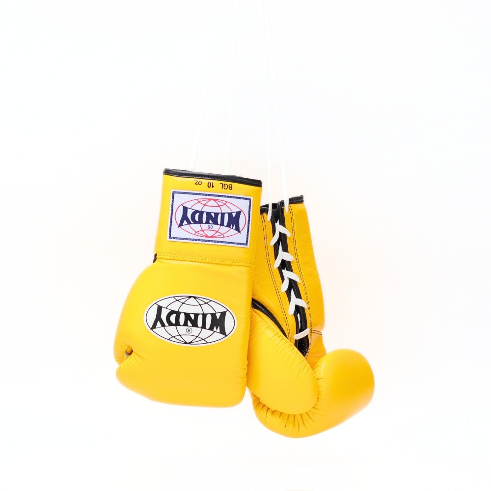 Front view of yellow Windy BGL lace-up boxing gloves showing padded knuckles, white laces, black trim and Windy branding on a white background