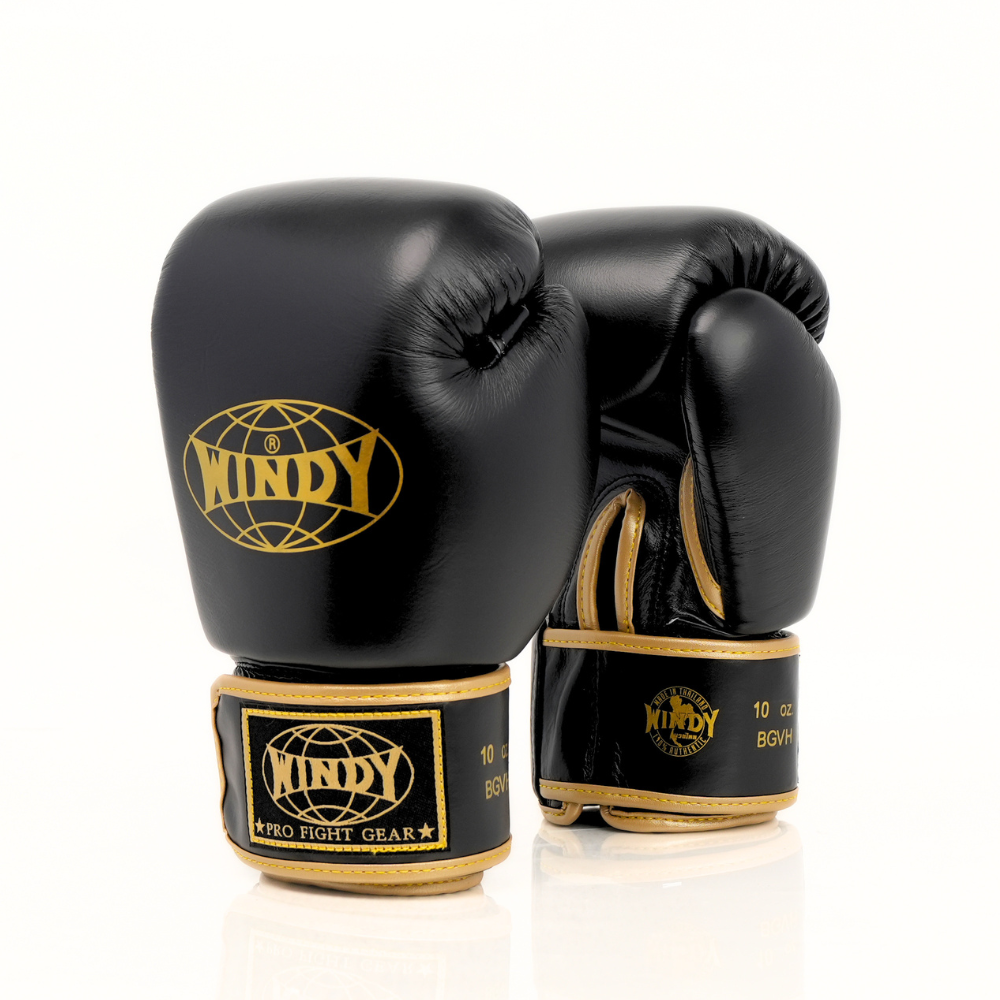 Palm-side view of Windy BGVH black and gold Muay Thai boxing gloves showing stitched leather palms, thumb opening and padded wrist support on a white background