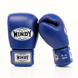 Angled view of blue Windy BGVH Muay Thai boxing gloves showing padded knuckles, thumb guard, leather construction and secure wrist closure on a white background