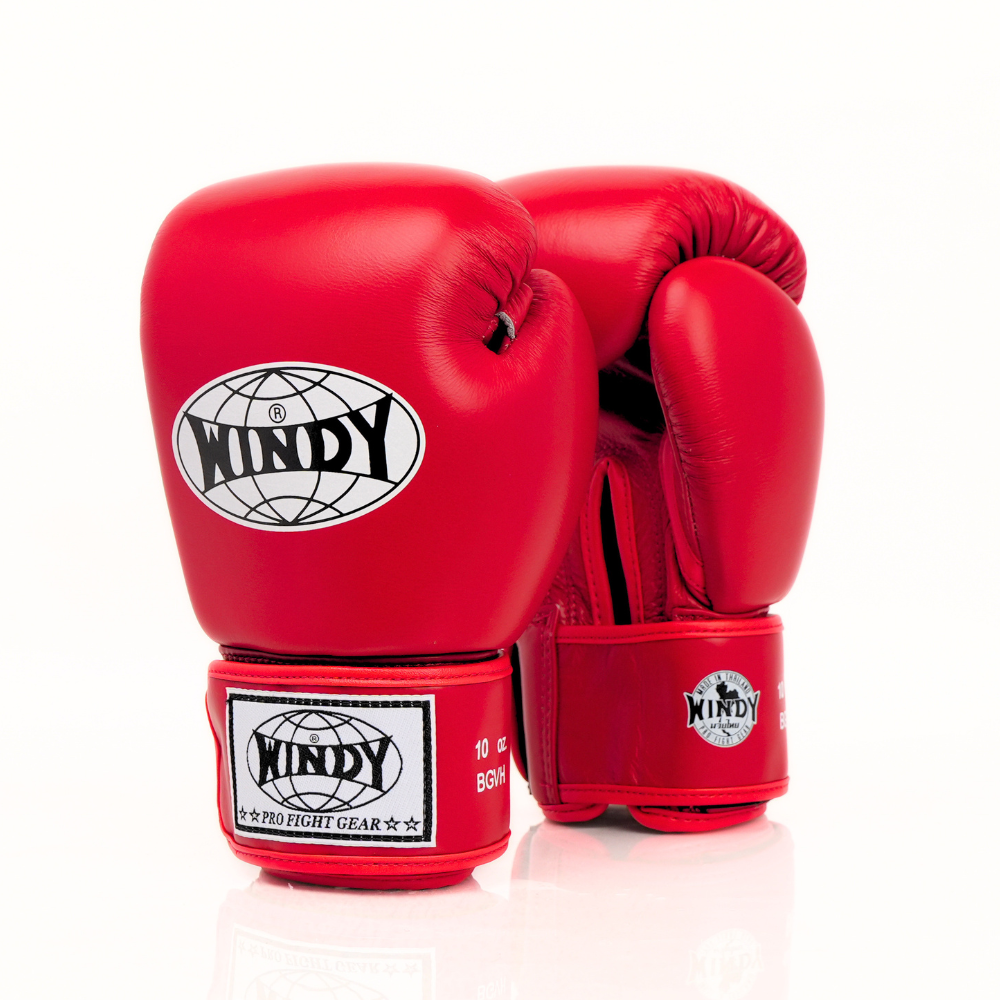 Palm-side view of a pair of red Windy BGVH leather Muay Thai boxing gloves showing stitched palms, thumb openings and hook-and-loop wrist closures on a white background