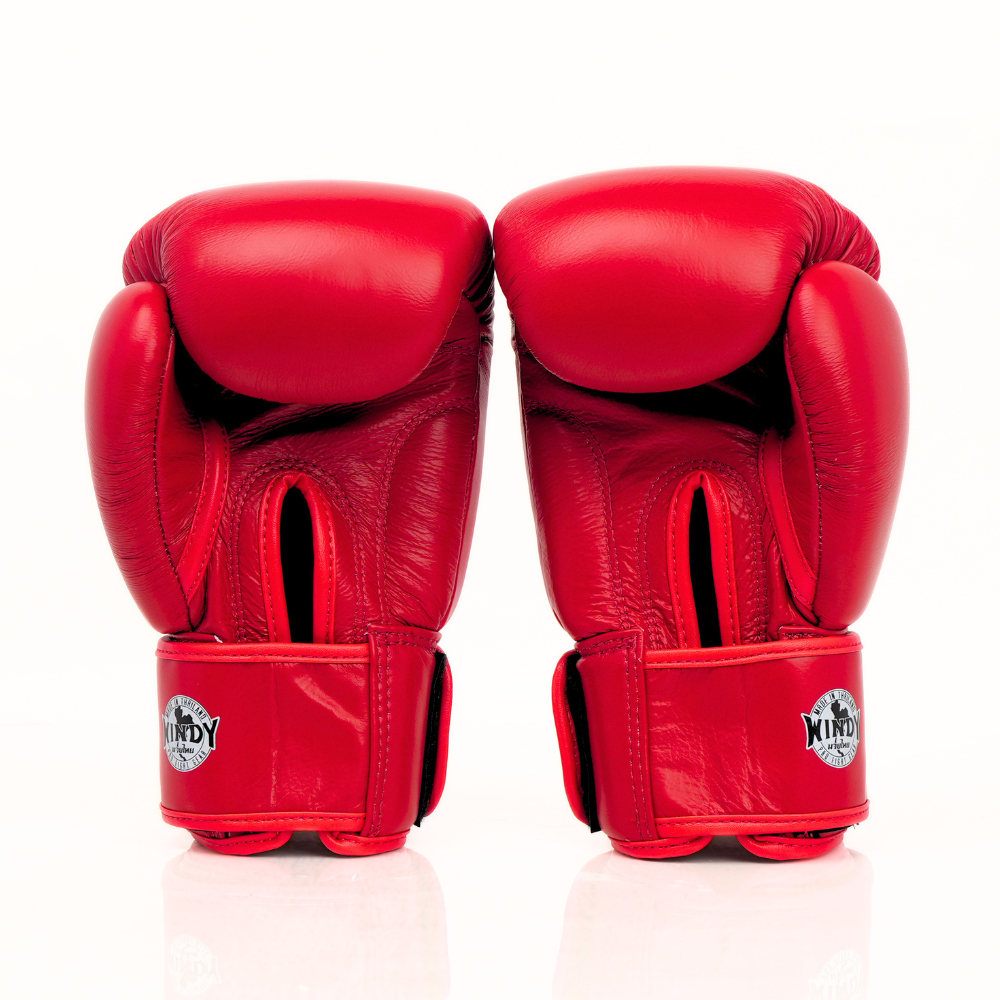 Rear view of a pair of red Windy BGVH leather Muay Thai boxing gloves showing padded backs, wrist closures and Windy branding on a white background